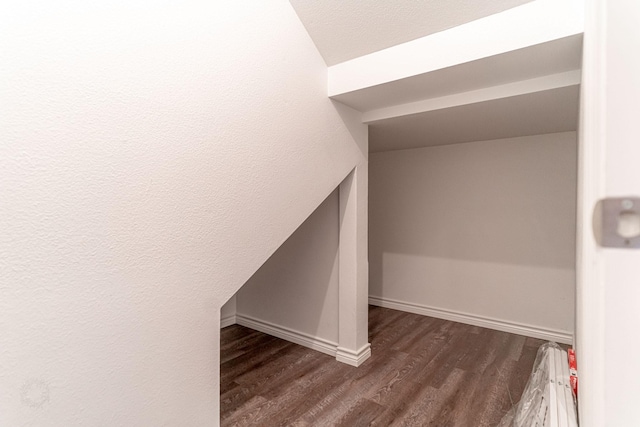 interior space with dark wood-style floors and baseboards