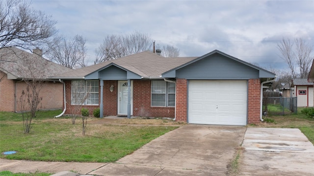 ranch-style home with fence, concrete driveway, a front yard, a garage, and brick siding