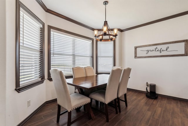 dining space featuring crown molding, a notable chandelier, baseboards, and wood finish floors