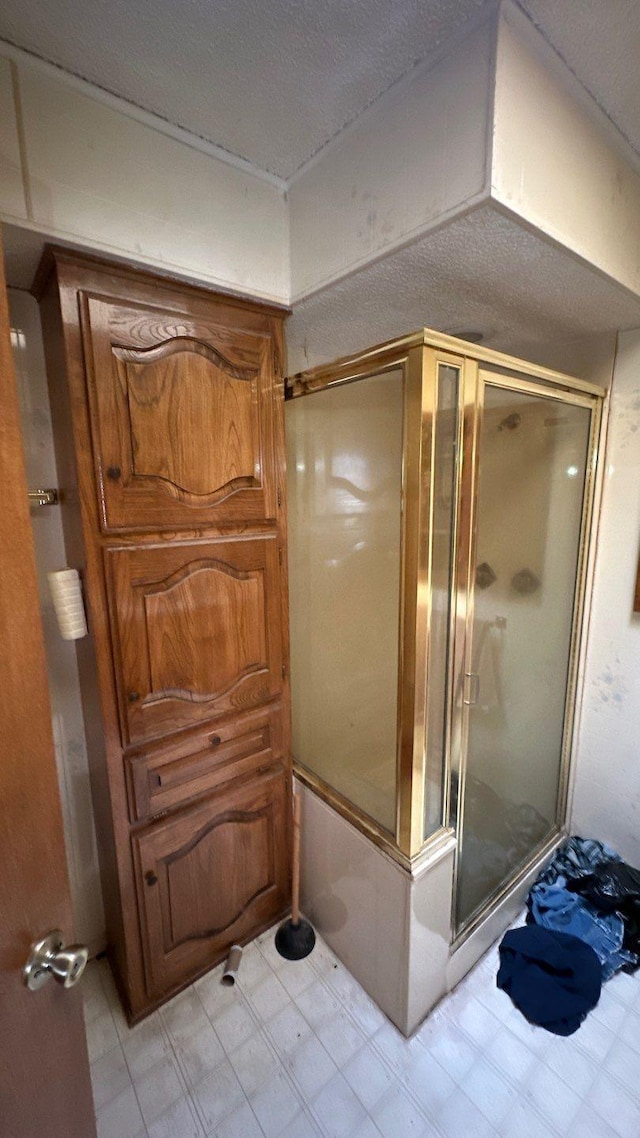 full bath with tile patterned floors and an enclosed shower