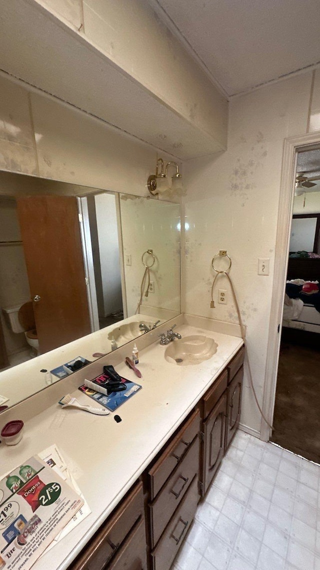 bathroom with tile patterned floors and vanity