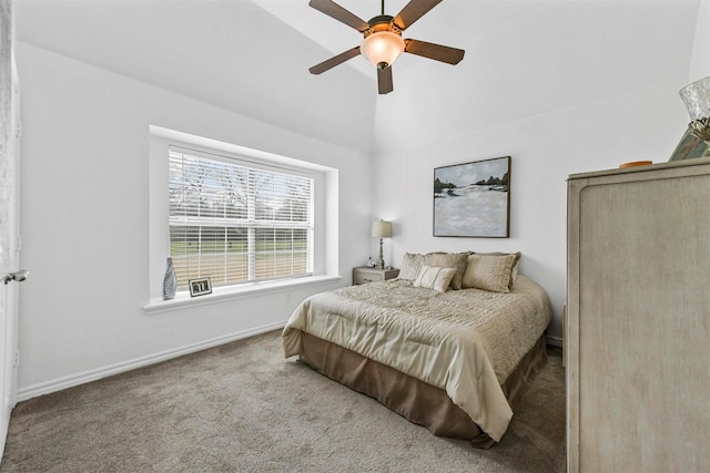 bedroom with lofted ceiling, carpet flooring, baseboards, and ceiling fan