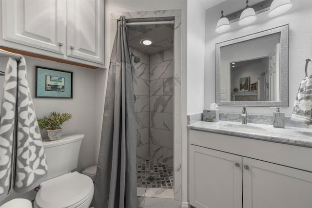 full bathroom with marble finish floor, a stall shower, toilet, and vanity