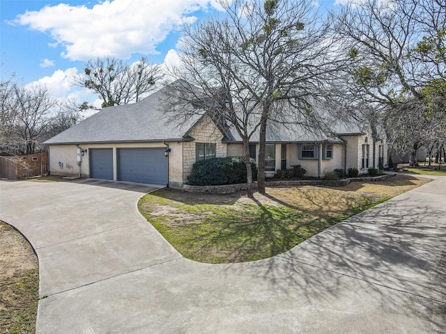 single story home with brick siding, a shingled roof, fence, concrete driveway, and an attached garage