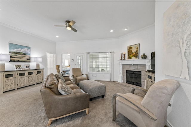 carpeted living room with a fireplace with flush hearth, recessed lighting, crown molding, and ceiling fan