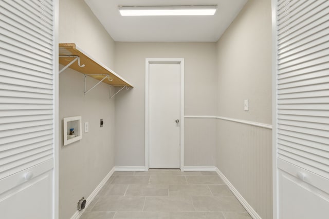 laundry area featuring baseboards, washer hookup, light tile patterned floors, laundry area, and hookup for an electric dryer