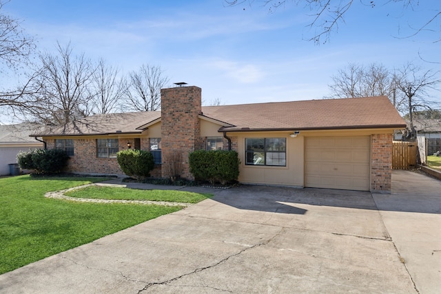 ranch-style house featuring a front lawn, fence, a chimney, driveway, and an attached garage