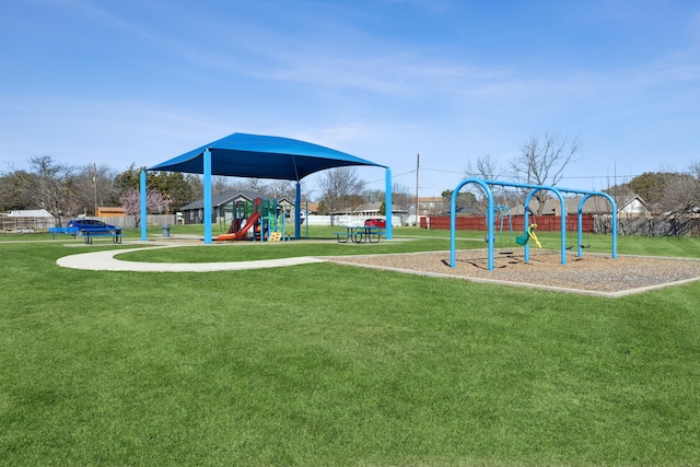 communal playground featuring a yard