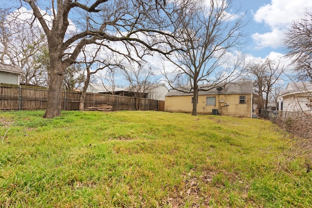 view of yard with central air condition unit and fence private yard