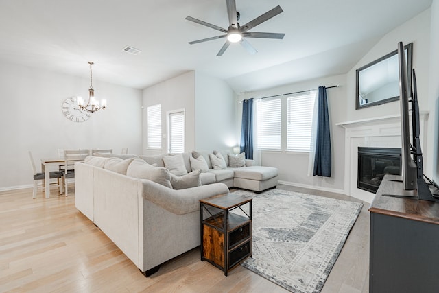 2304 Ravensway Rd, Crandall, TX 75114 - living room featuring healthy amount of natural light, ceiling fan, a chandelier, light wood-type flooring, and vaulted ceiling