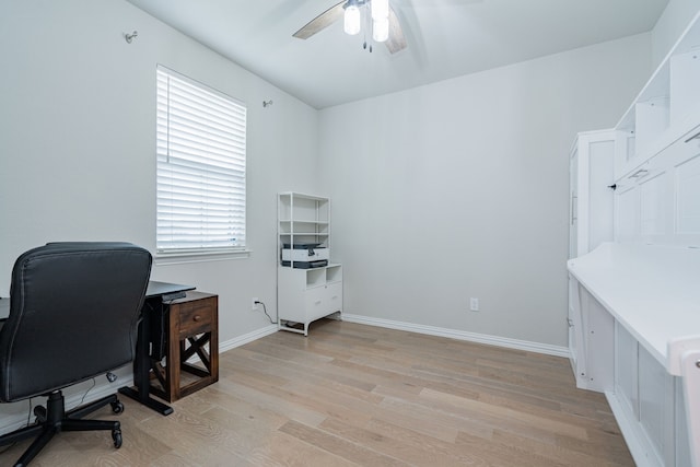 office with baseboards, light wood finished floors, and ceiling fan