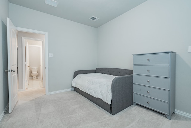 bedroom with light colored carpet, visible vents, and baseboards