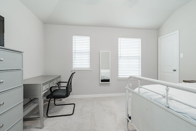 bedroom with carpet flooring, baseboards, and vaulted ceiling