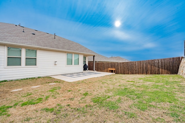 view of yard featuring a patio and a fenced backyard