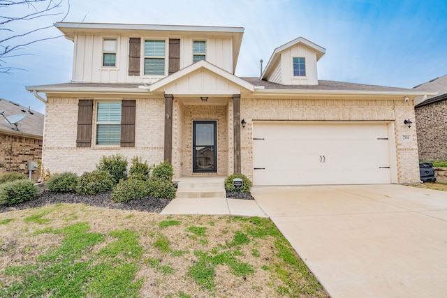2304 Ravensway Rd, Crandall, TX 75114 - view of front facade featuring brick siding, board and batten siding, driveway, and a garage