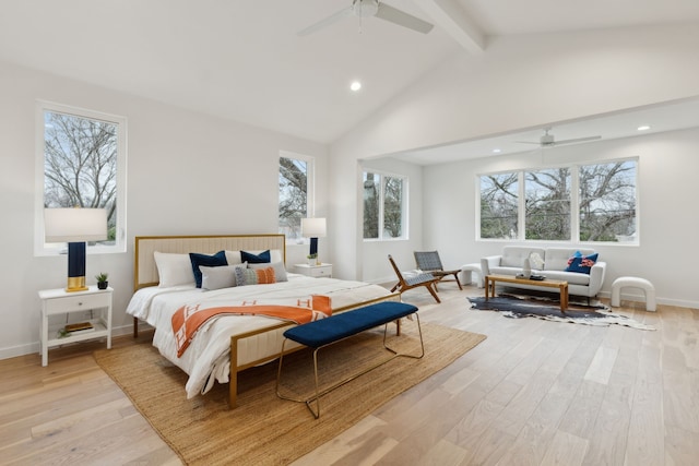 bedroom with lofted ceiling with beams, baseboards, a ceiling fan, and light wood finished floors