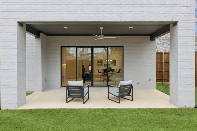 view of patio / terrace featuring ceiling fan and fence