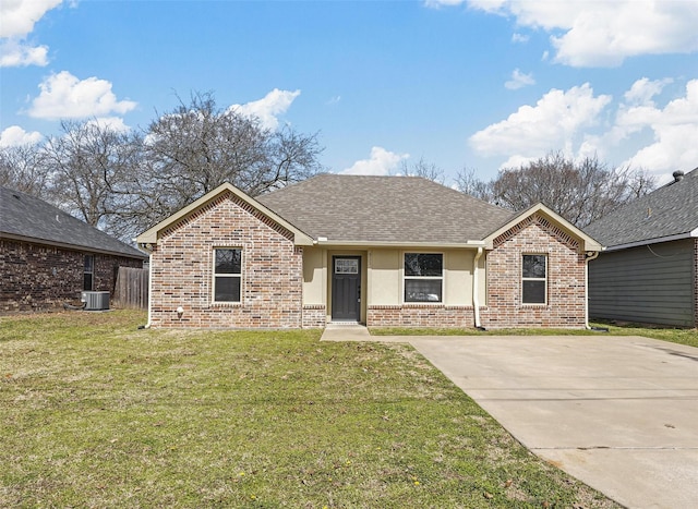 ranch-style home featuring stucco siding, a front lawn, central AC, roof with shingles, and brick siding