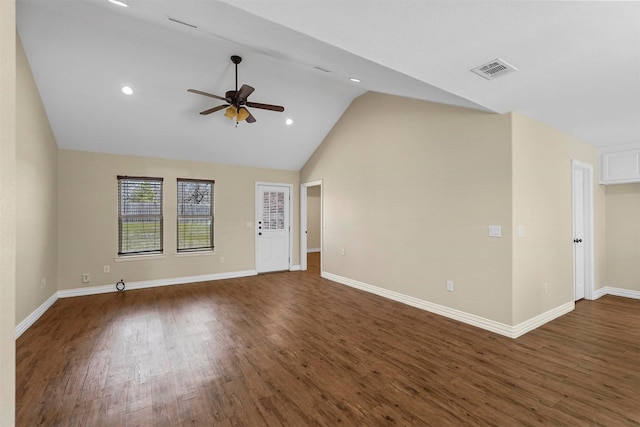 unfurnished living room featuring visible vents, dark wood-type flooring, and baseboards