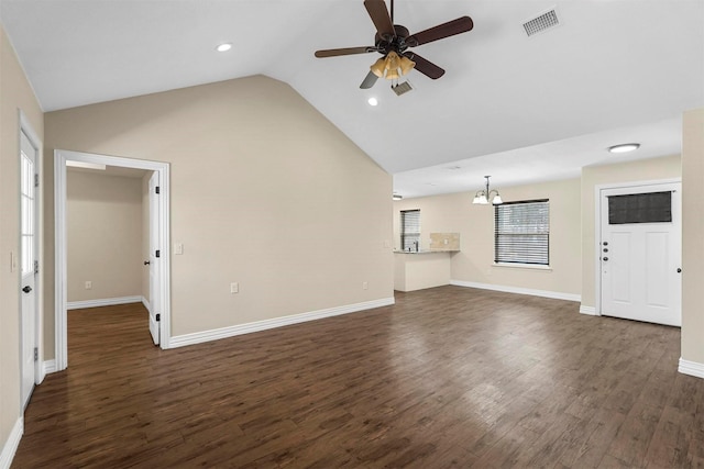 unfurnished living room featuring visible vents, baseboards, lofted ceiling, dark wood-type flooring, and ceiling fan with notable chandelier