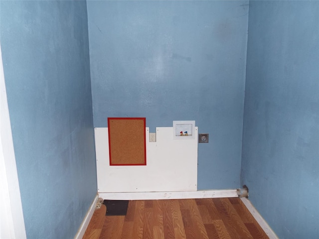 clothes washing area with laundry area, hookup for a washing machine, and wood finished floors