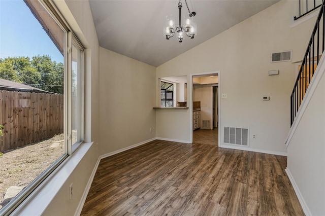 unfurnished dining area with stairs, wood finished floors, and visible vents