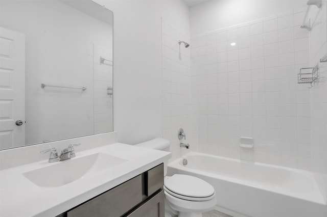 bathroom featuring vanity, shower / bathing tub combination, and toilet