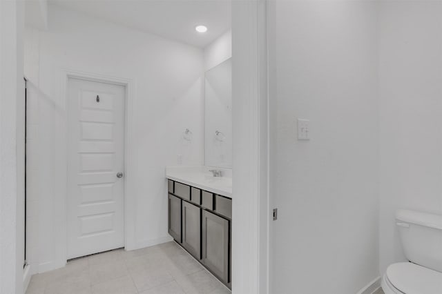 3917 Spencer Ln, Heartland, TX 75126 - full bathroom featuring vanity, toilet, tile patterned flooring, and baseboards