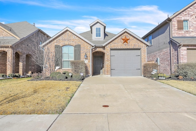 3917 Spencer Ln, Heartland, TX 75126 - french country home with brick siding, driveway, a front lawn, an attached garage, and a shingled roof