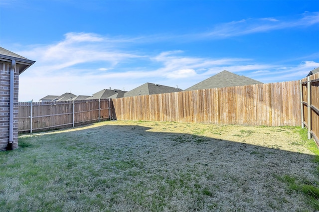 view of yard featuring a fenced backyard