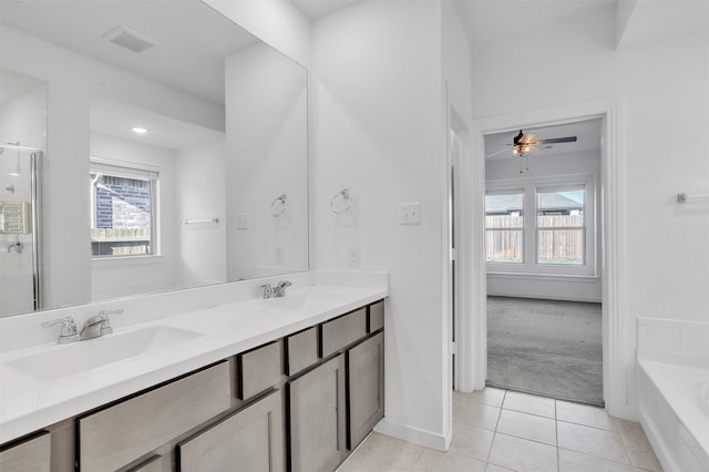 3917 Spencer Ln, Heartland, TX 75126 - bathroom featuring tile patterned flooring, double vanity, a garden tub, a ceiling fan, and an enclosed shower