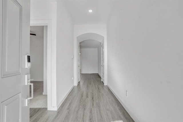 3917 Spencer Ln, Heartland, TX 75126 - hall featuring arched walkways, light wood-style floors, baseboards, and recessed lighting