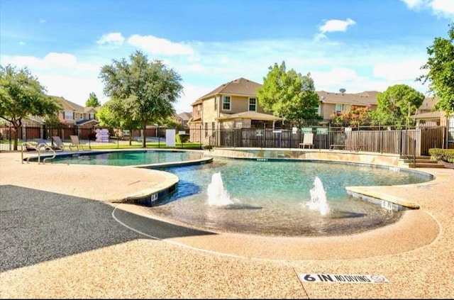 pool featuring a residential view and fence