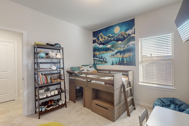 bedroom with carpet flooring and baseboards