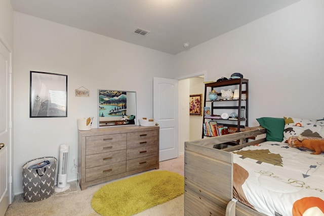 bedroom featuring light carpet, visible vents, and baseboards