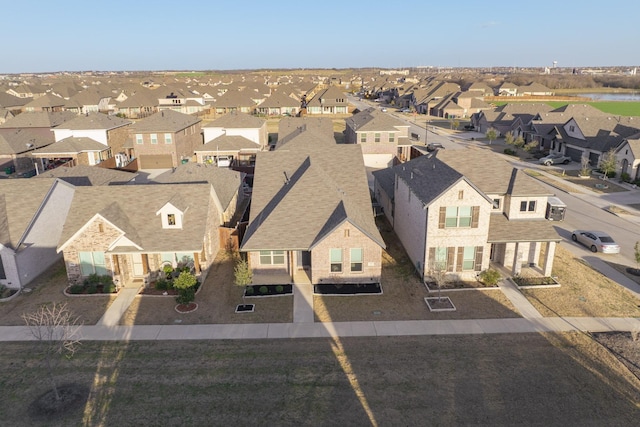 birds eye view of property with a residential view