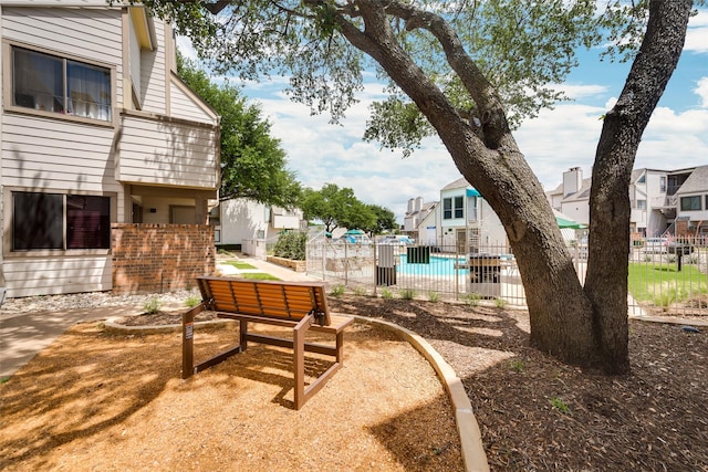 view of yard with a patio area, a residential view, and fence