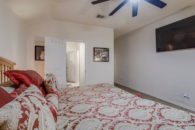 bedroom featuring visible vents, a ceiling fan, baseboards, carpet flooring, and lofted ceiling