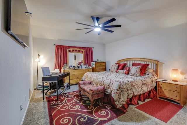 carpeted bedroom with baseboards and ceiling fan