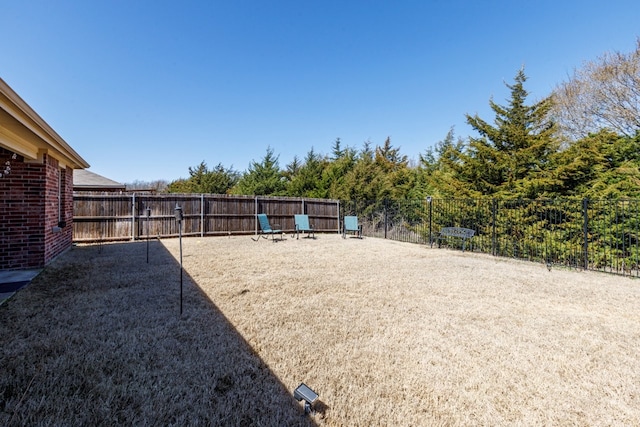 view of yard featuring fence