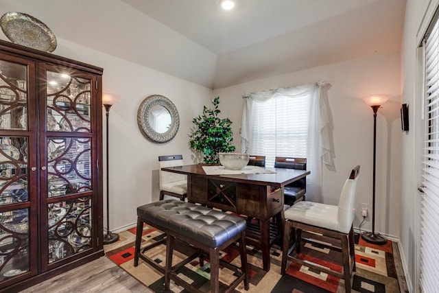 interior space with lofted ceiling, recessed lighting, wood finished floors, and baseboards