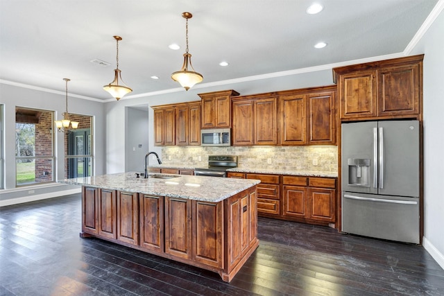 kitchen featuring a sink, dark wood-style floors, stainless steel appliances, decorative backsplash, and light stone countertops