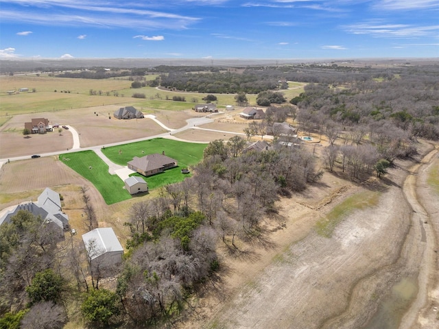 birds eye view of property with a rural view