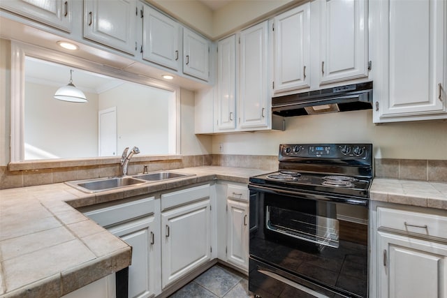 4034 Rawlins St Unit 102, Dallas, TX 75219 - kitchen featuring black / electric stove, under cabinet range hood, a sink, white cabinetry, and ornamental molding