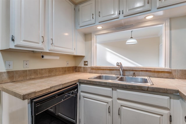 4034 Rawlins St Unit 102, Dallas, TX 75219 - kitchen with a sink, white cabinetry, dishwasher, and crown molding