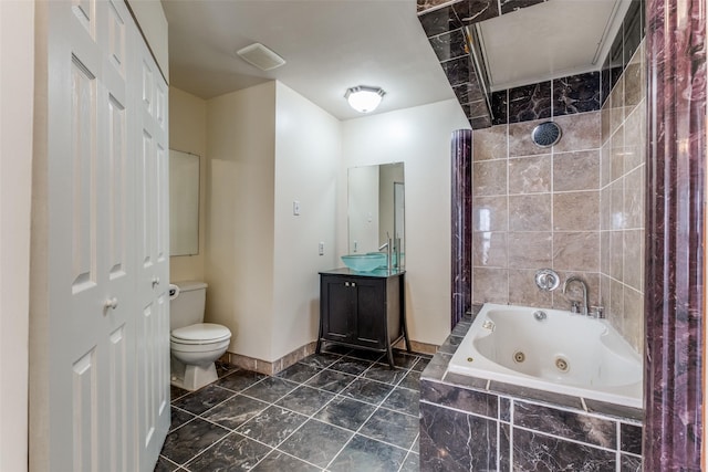 4034 Rawlins St Unit 102, Dallas, TX 75219 - full bath featuring toilet, vanity, and tile patterned flooring