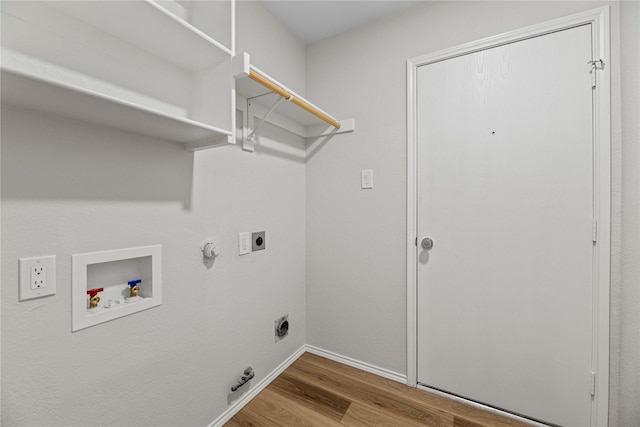 laundry room with wood finished floors, laundry area, electric dryer hookup, washer hookup, and hookup for a gas dryer