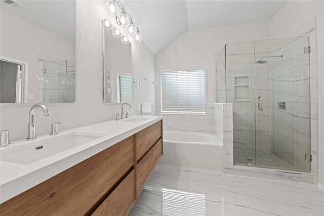 full bathroom featuring a marble finish shower, marble finish floor, lofted ceiling, and a sink