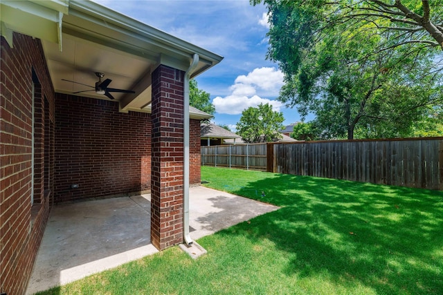 view of yard with ceiling fan, a patio, and a fenced backyard