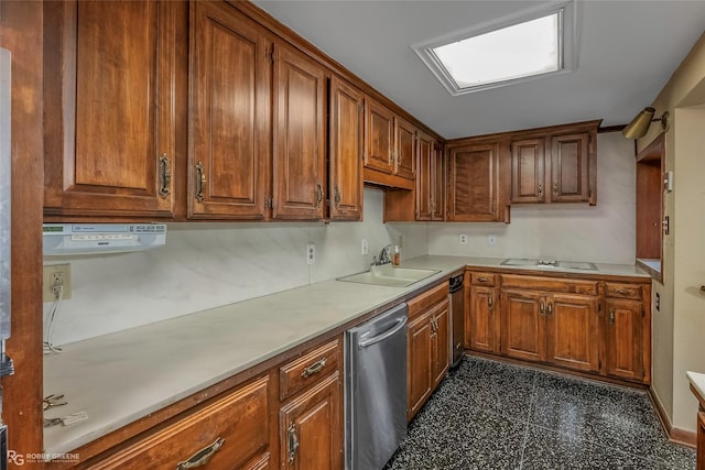 kitchen with brown cabinetry, a sink, light countertops, stovetop with downdraft, and dishwasher